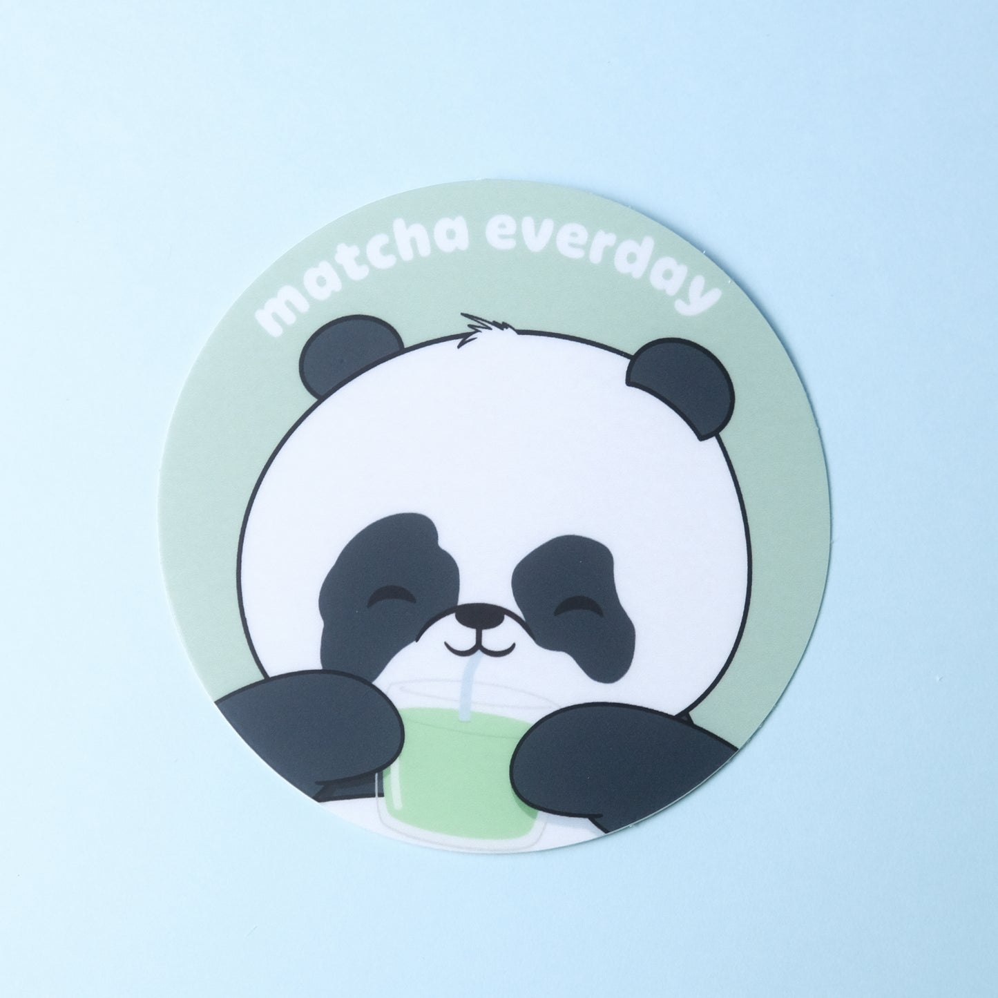 Round sticker of our cute panda drinking a glass of matcha with the phrase “matcha everyday”