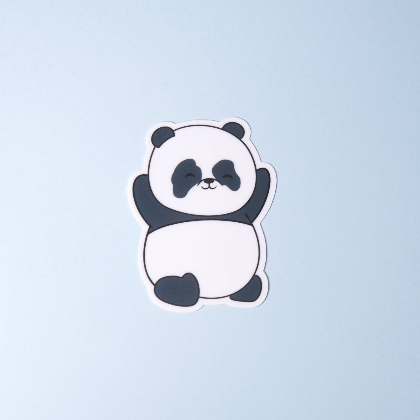 Panda with paws up in the air