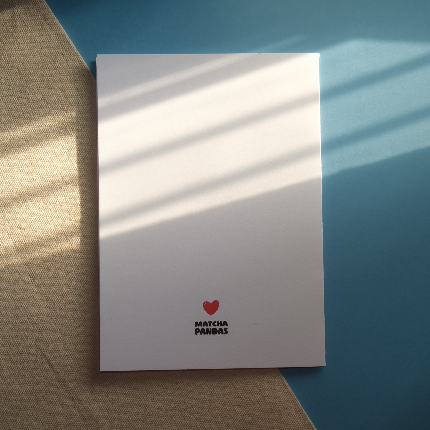 Back of You're the Beary Best Card. Image of Matcha Pandas logo and red heart balloon.