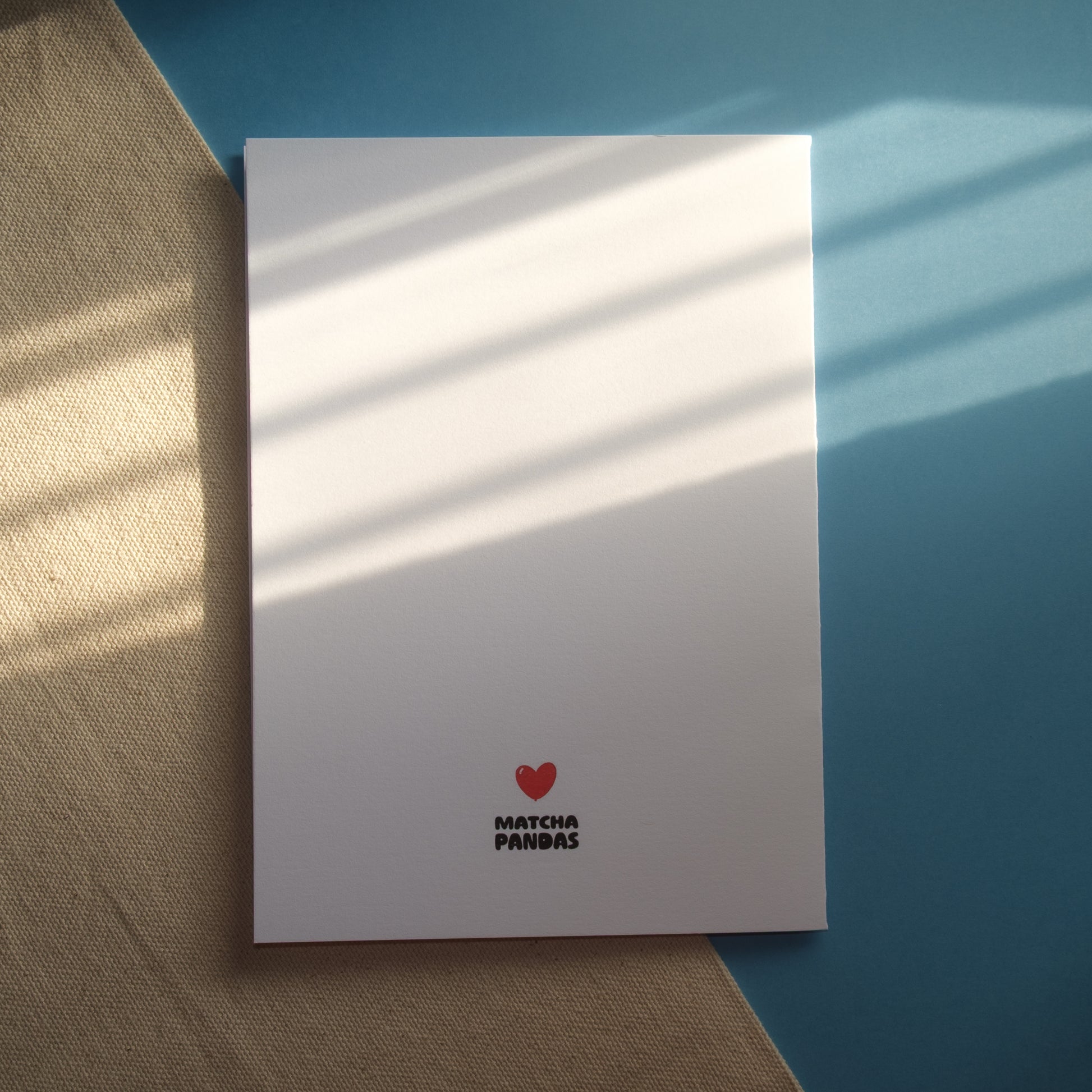 Back of You're the Beary Best Card. Image of Matcha Pandas logo and red heart balloon.