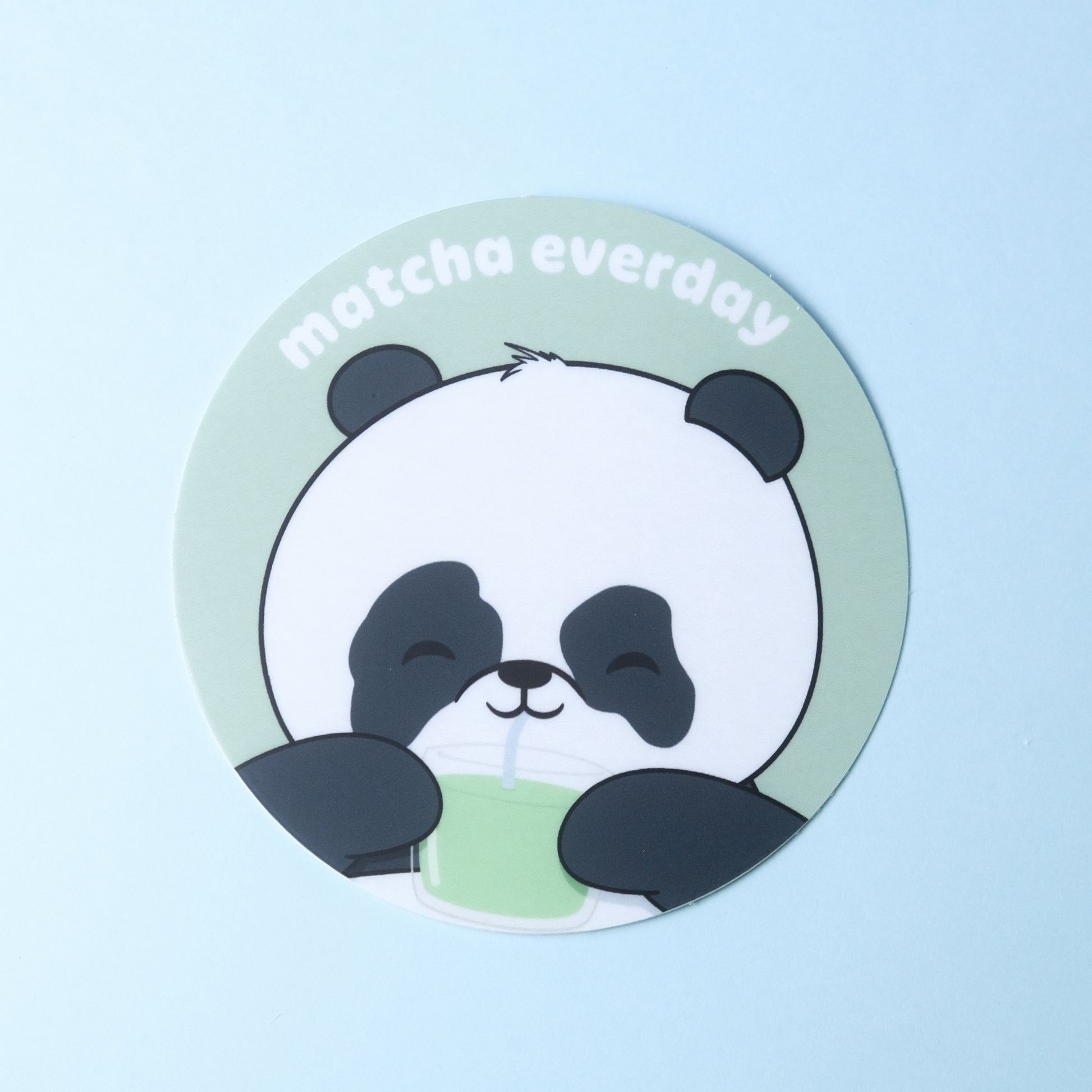Round sticker of our cute panda drinking a glass of matcha with the phrase “matcha everyday”