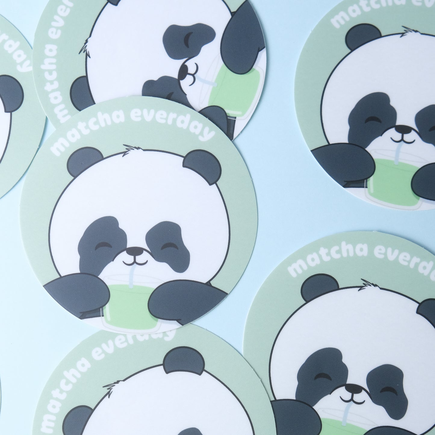 Round sticker of our cute panda drinking a glass of matcha with the phrase “matcha everyday”