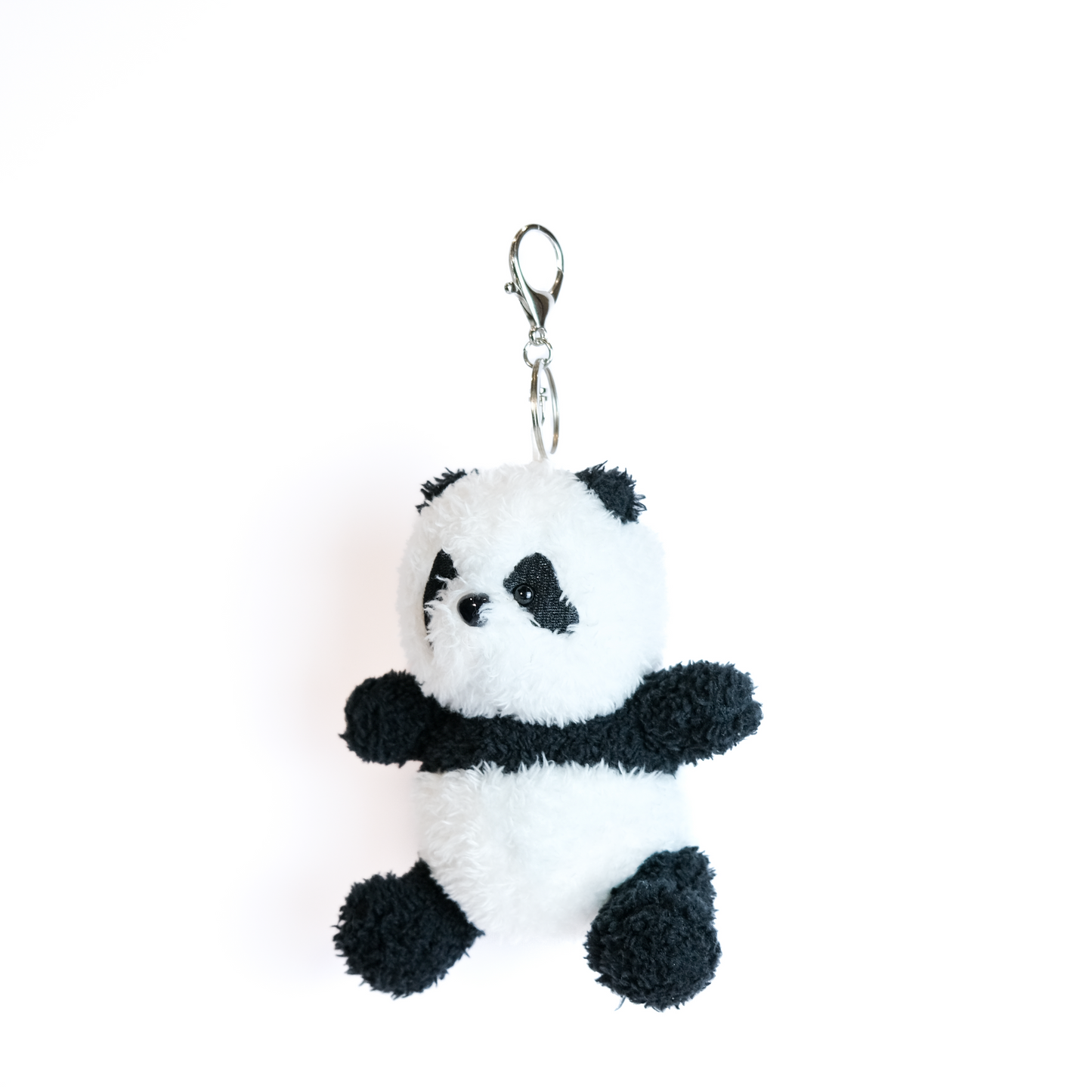 Left side view of panda plush keychain