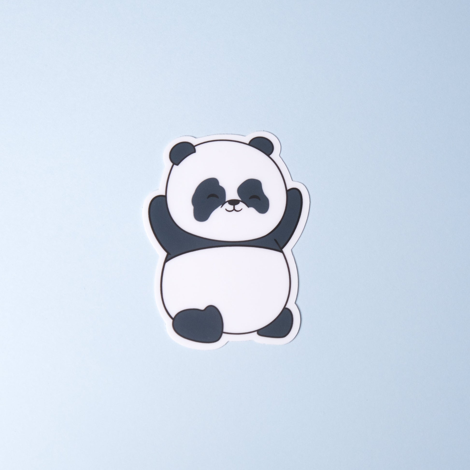 Panda with paws up in the air