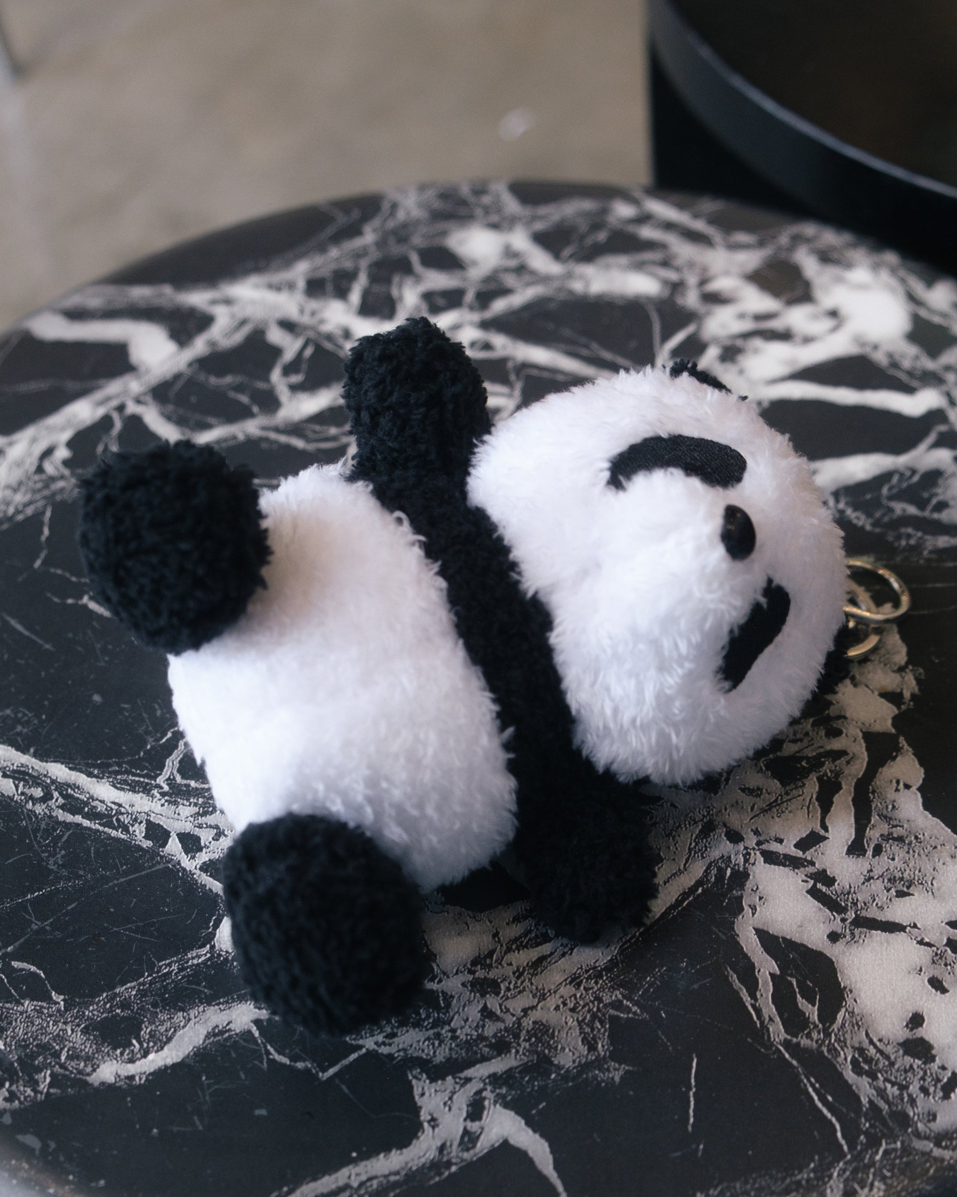 Small fluffy panda plush keychain, perfect for decorating keys, purses, or backpacks.