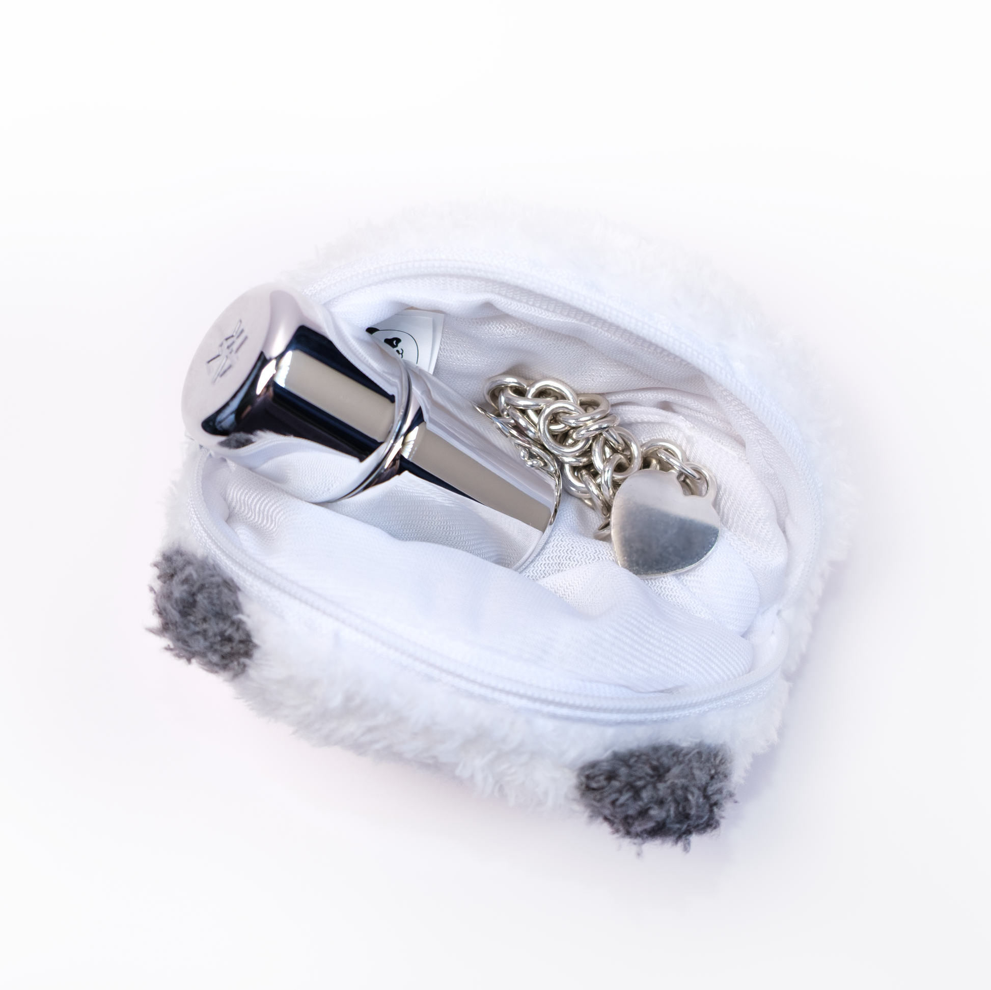 Panda plush pouch unzipped with items inside