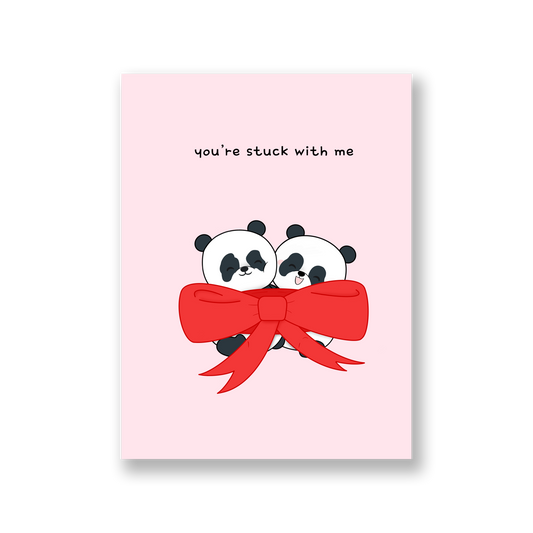 Pink card of two pandas wrapped inside a giant bow with the text, "you're stuck with me"
