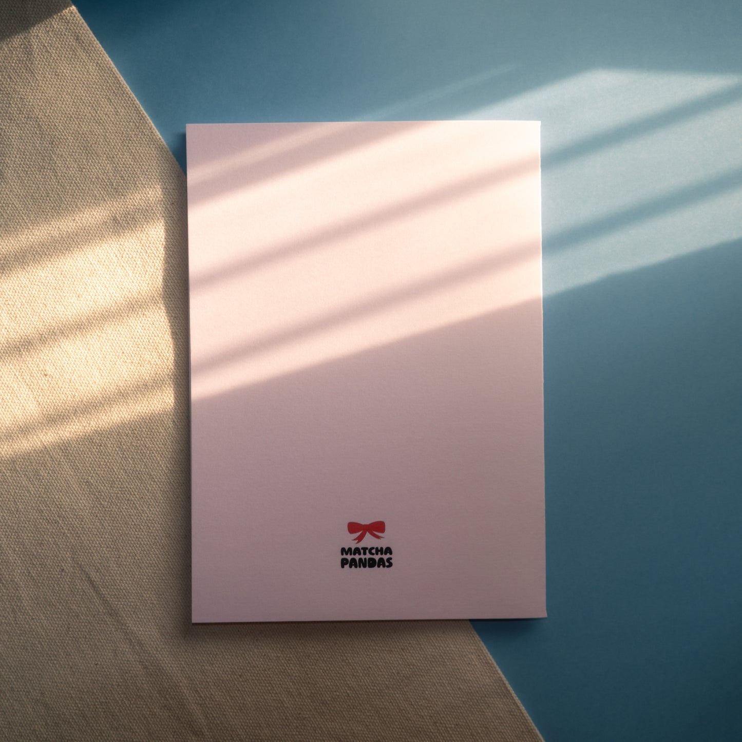 Back of You're Stuck With Me Card - Matcha Pandas logo and red bow